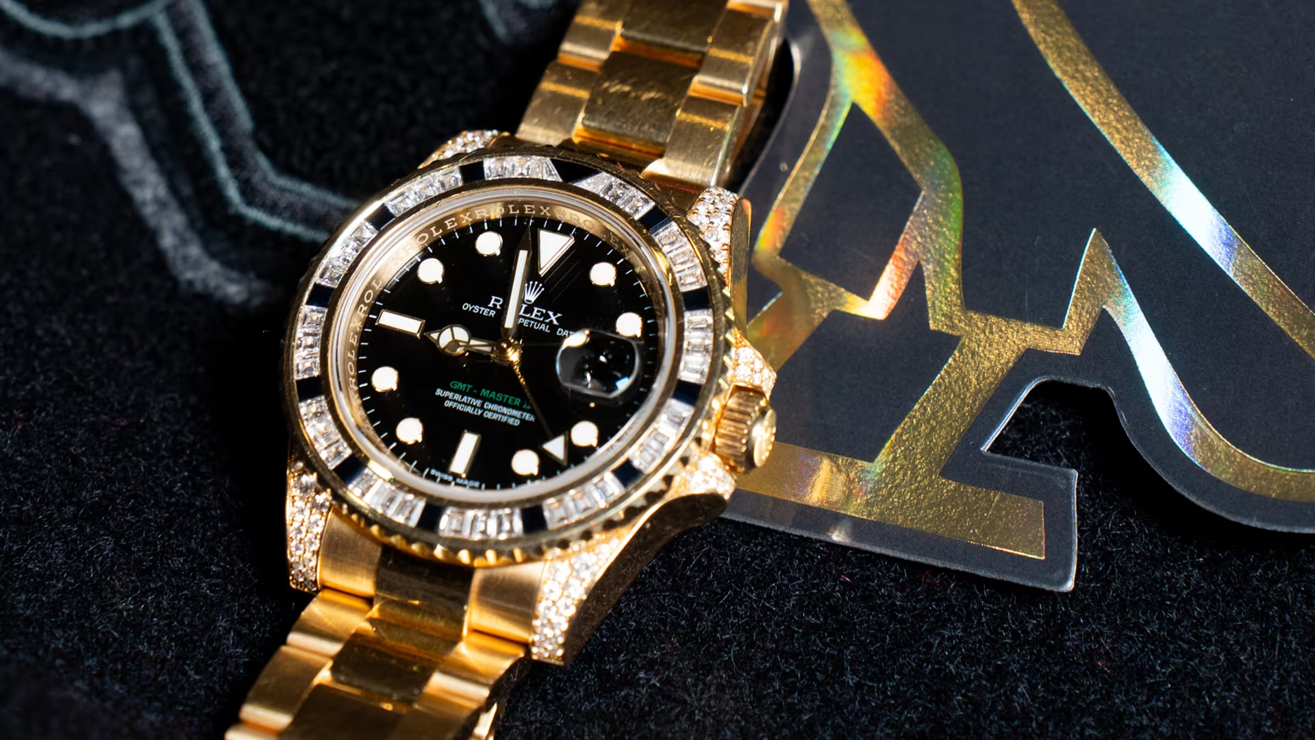Title AI: Drake's Gold and Diamond Rolex GMT Sold for $500,000